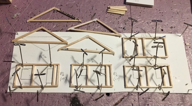 Four wall frames and two trusses, pinned and glued.